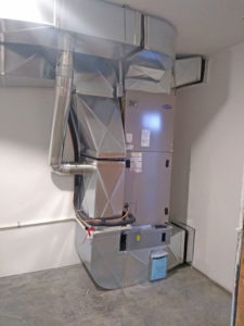 Electric furnace with heat pump coils